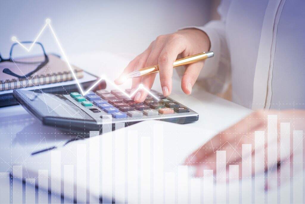 Accountant Calculating Profit With Financial Analysis Graphs - Exactus Consultoria